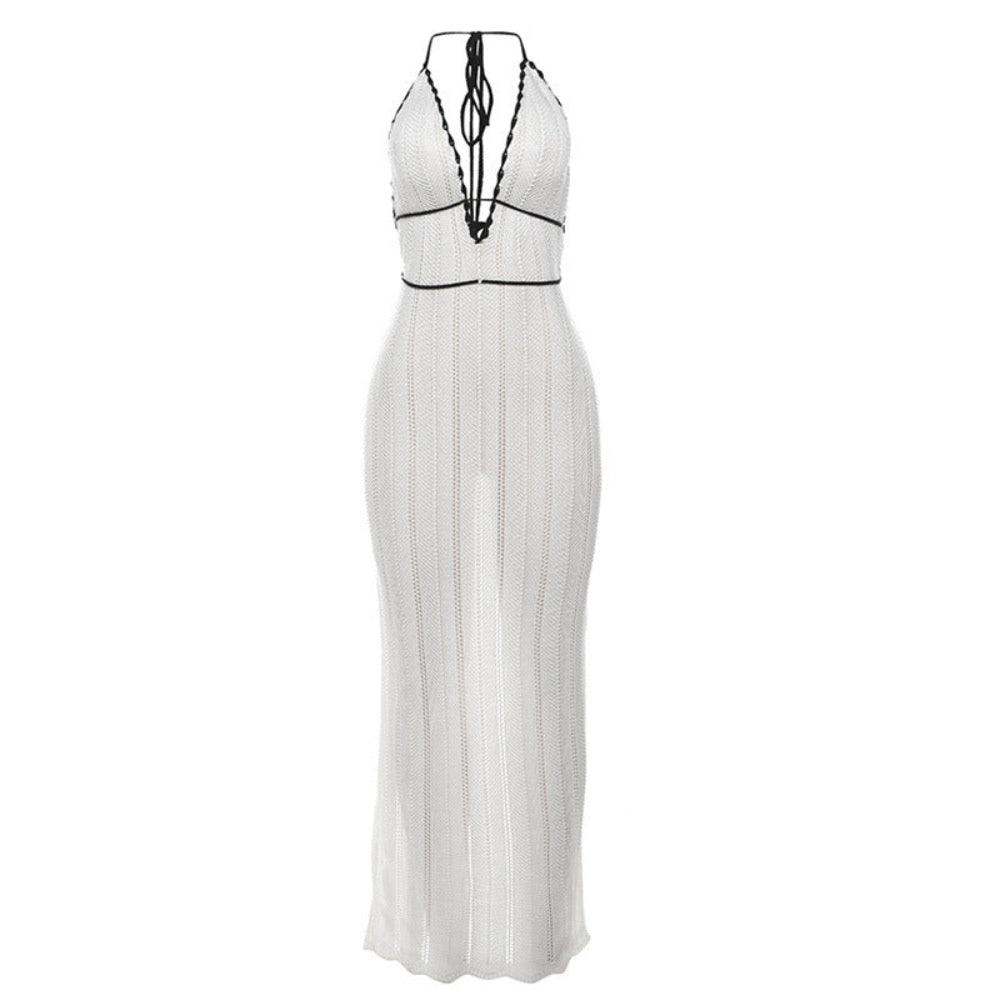 Front view of white ribbed knit halter maxi dress with black lace-up tie back and contrast trim.