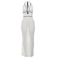Front view of white ribbed knit halter maxi dress with black lace-up tie back and contrast trim.