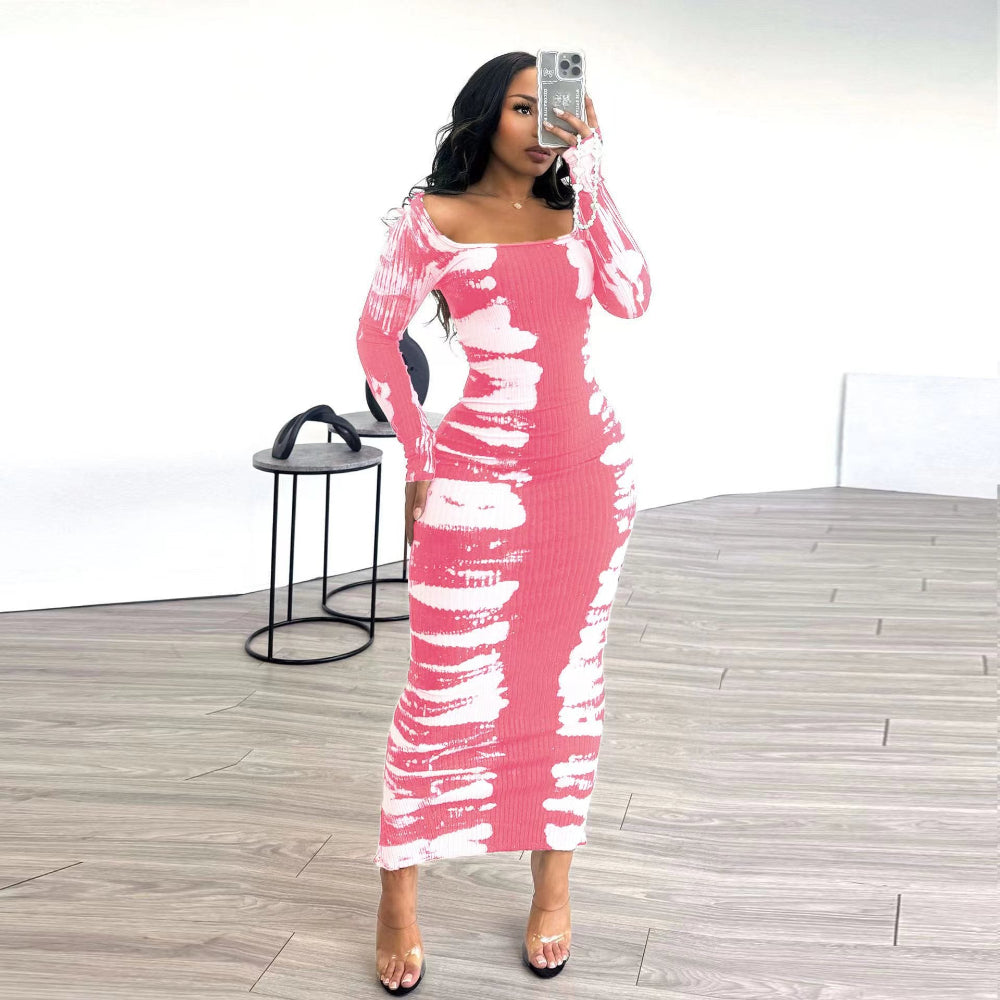Woman taking mirror selfie in pink and white tie-dye ribbed long-sleeve off-shoulder bodycon midi dress.