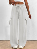 Light gray wide-leg pants with drawstring waist on a white background