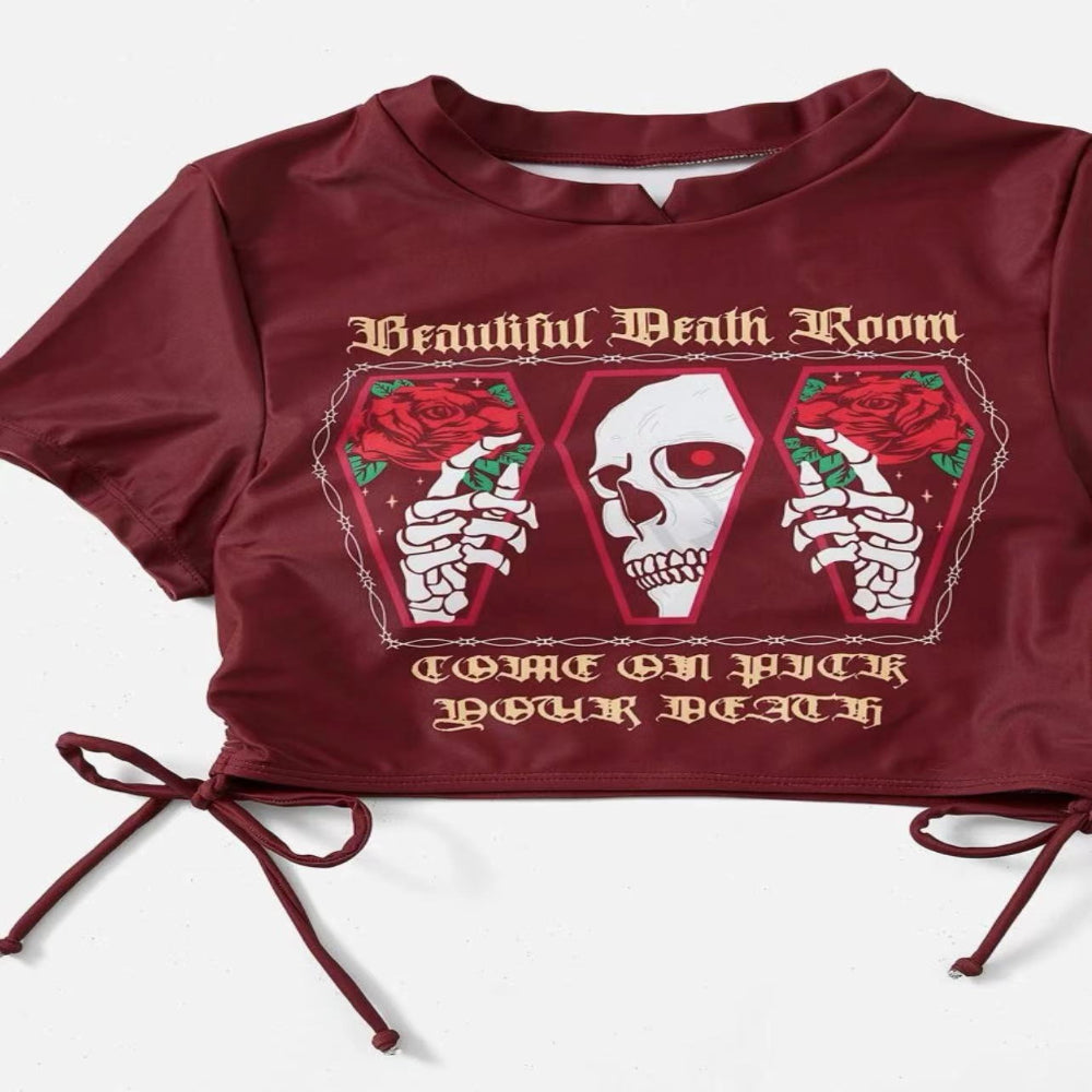Maroon crop top with graphic design and text on a white background