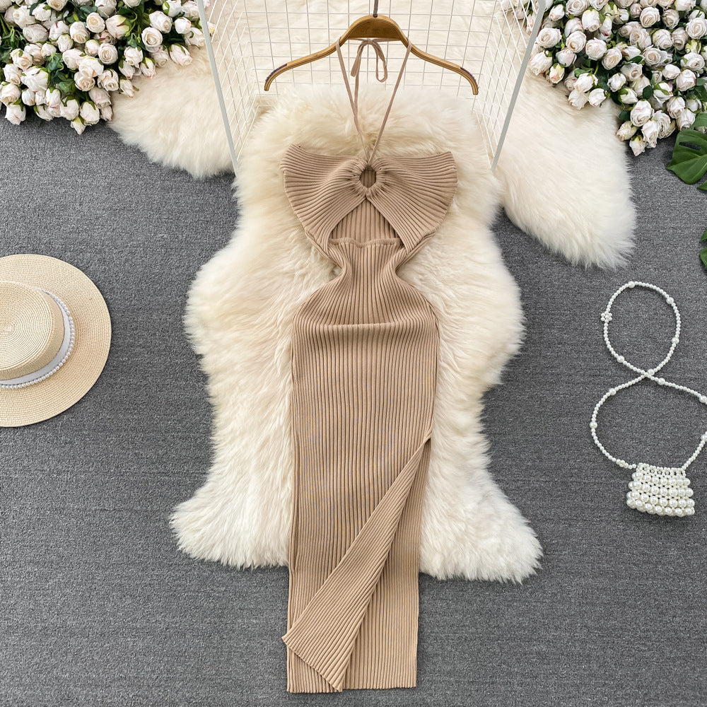 Beige ribbed knit halter maxi dress with front keyhole cutout on wooden hanger.