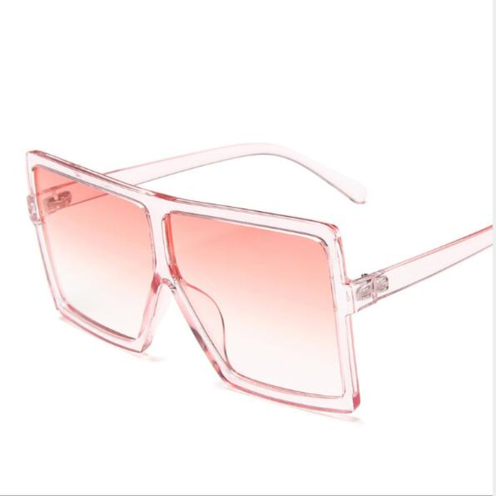 Sunglasses with a pink gradient lens and clear frame on a white background