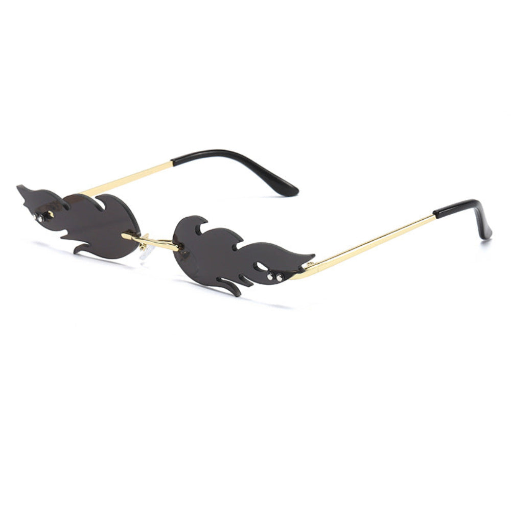 Rimless flame-shaped sunglasses with dark lenses and gold temples, product photo on a white background.