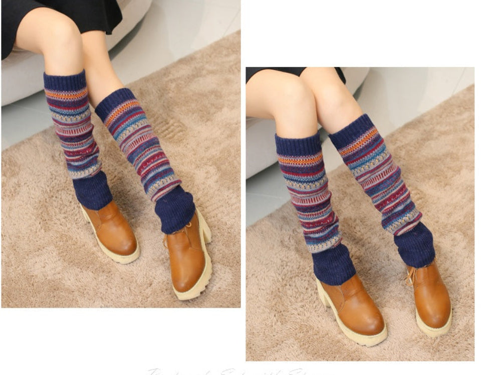 Striped knit leg warmers in navy, red, and orange worn over brown boots.