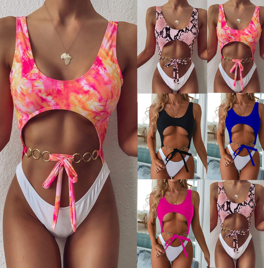 Cutout one-piece swimsuit collection in rainbow tie-dye, snake print, black, blue and pink with gold ring chain belt.