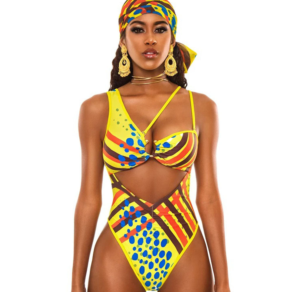 Woman wearing a colorful African print swimsuit on a white background