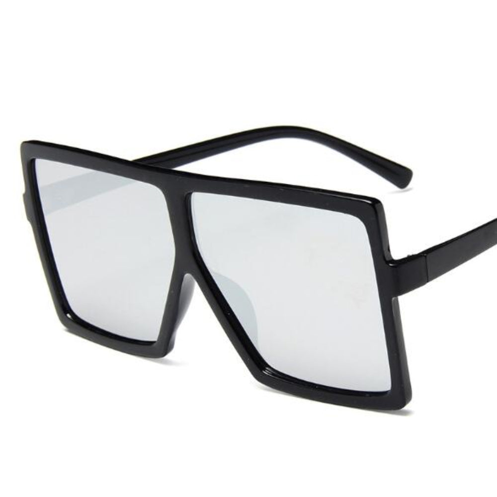 Black sunglasses with a white lens on a white background