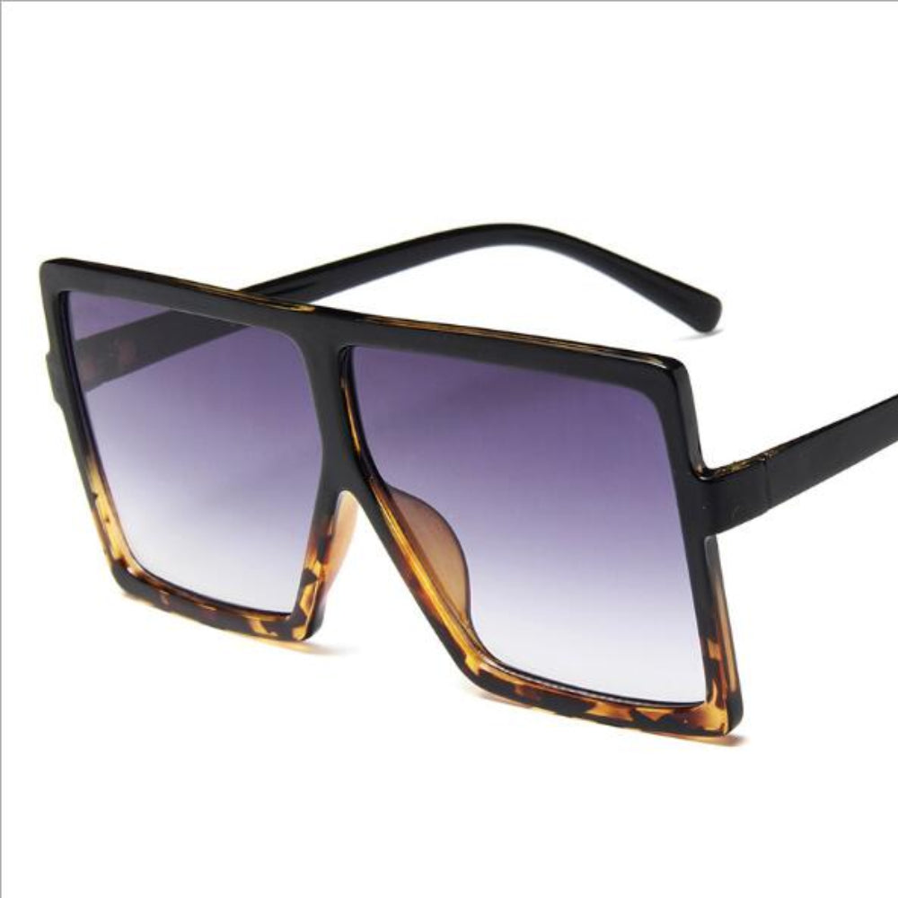 Sunglasses with a gradient lens on a white background