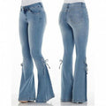 Front and back views of light blue flared jeans with side tie details at the flared hems, displayed on a mannequin. Stylish casual denim fashion product photography for Boutique Jolie.