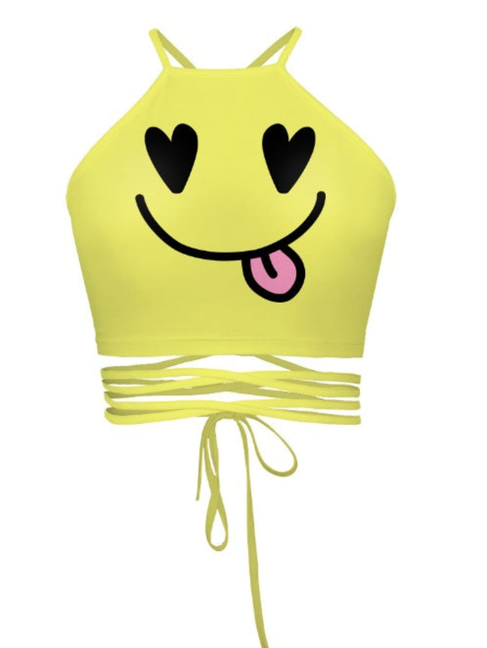 Yellow smiley face halter crop top with heart eyes and tongue-out emoji graphic, multi-strap tie-back detail, shown flat lay on white background.