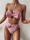 Pink glitter sparkle two-piece bikini set with bow detail bandeau top and matching bow high-waisted bottom.
