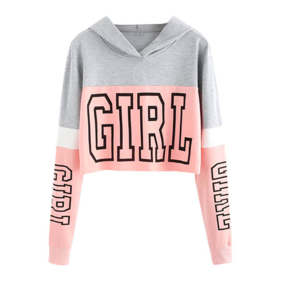 Grey and pink colorblock cropped hoodie with large "GIRL" graphic print on the front and sleeves, shown flat lay on white background.**