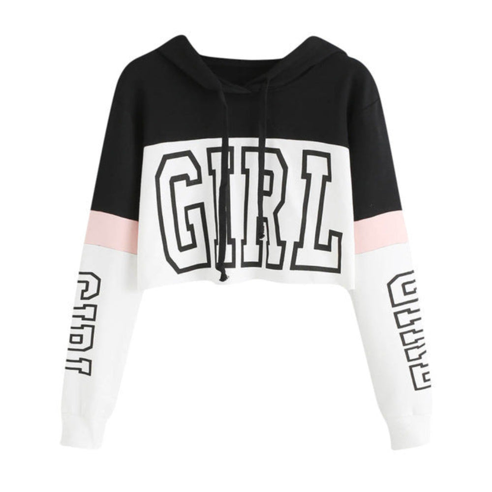 Black and white colorblock cropped hoodie with pink sleeve accents, large "GIRL" graphic print on the front and sleeves, shown flat lay on white background.