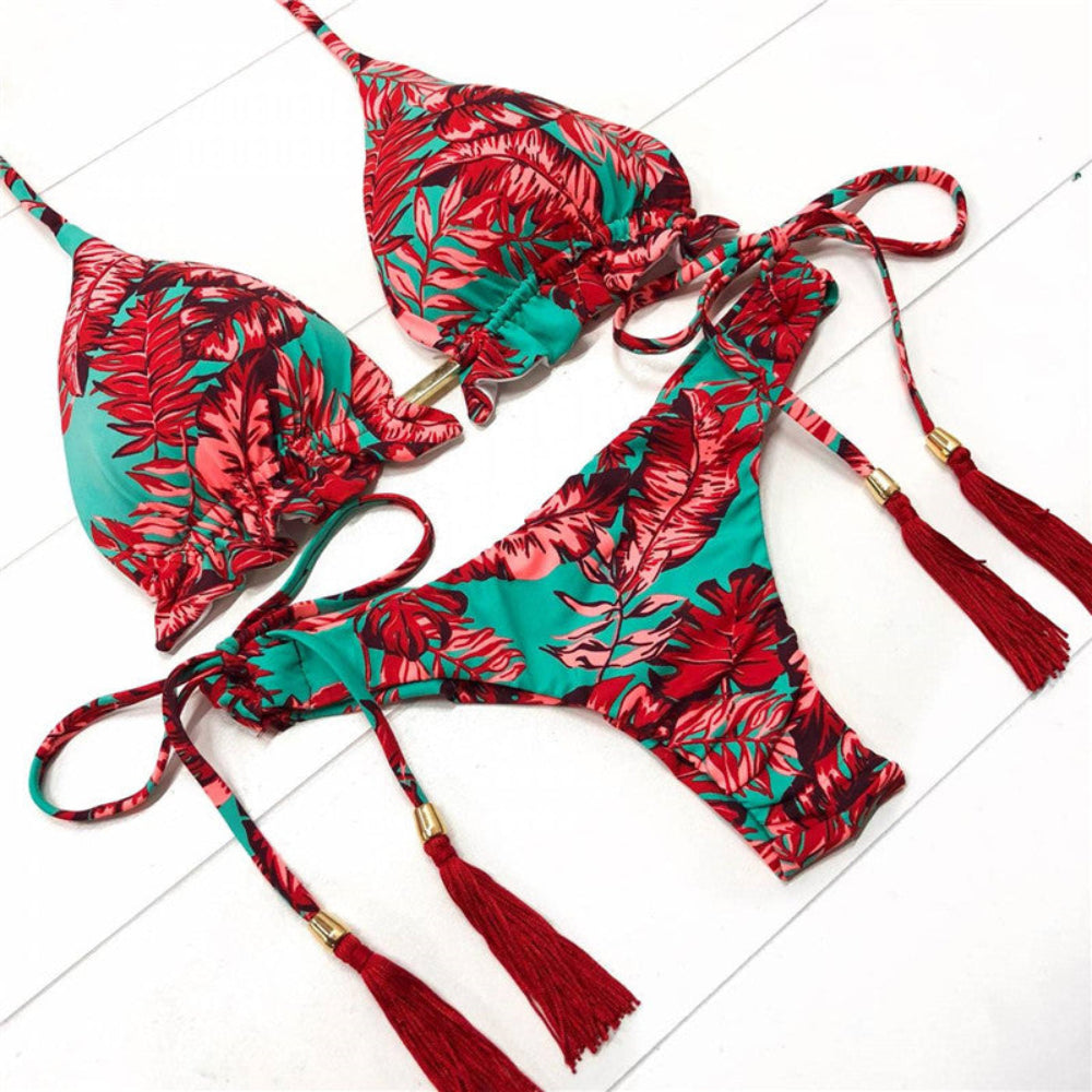 Red and green floral bikini set with tassels on a white background
