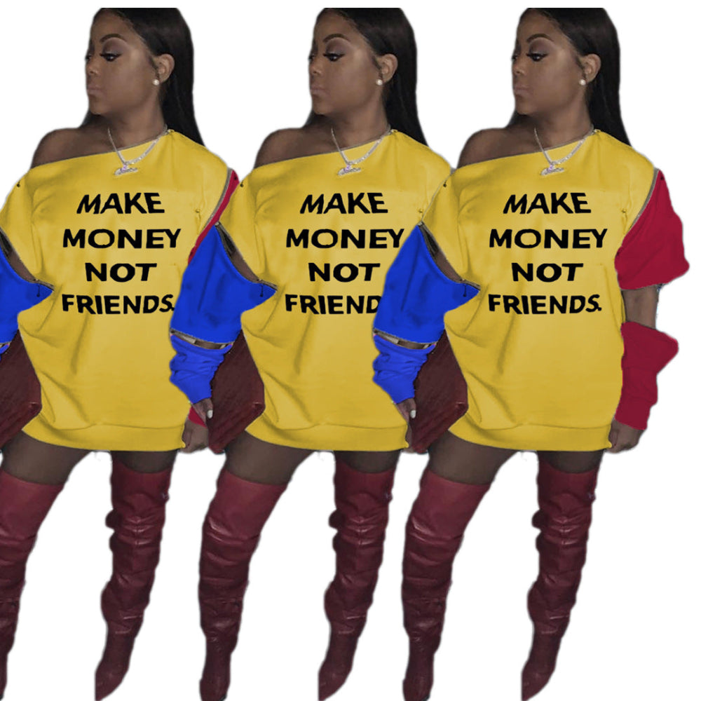 Woman wearing a yellow “Make Money Not Friends” color block sweatshirt dress with red and blue sleeves.
