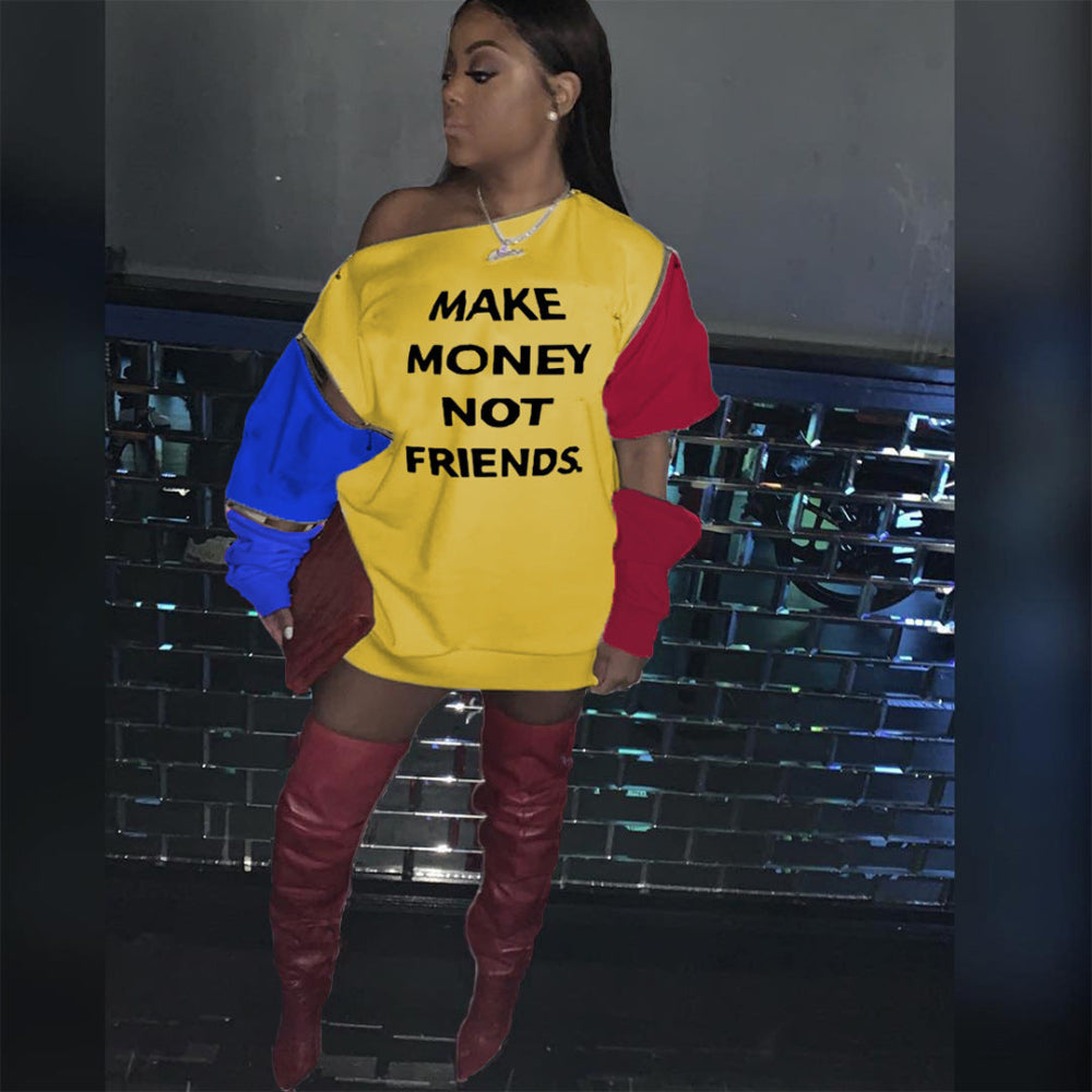 Woman wearing a yellow “Make Money Not Friends” color block sweatshirt dress with red and blue sleeves.