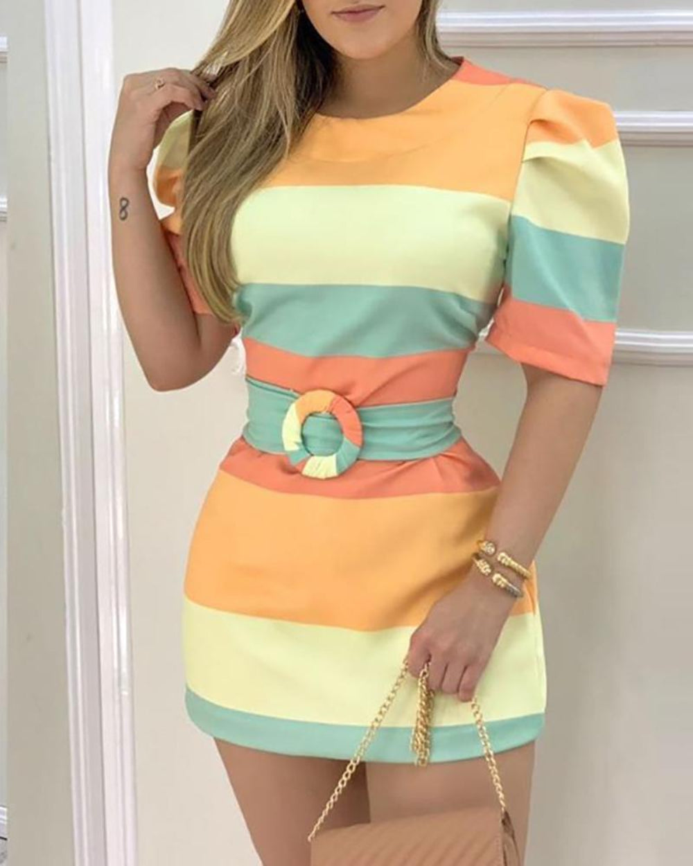 Colorful striped mini dress on model – trendy orange yellow mint puff sleeve bodycon dress with belt, indoor studio pose.