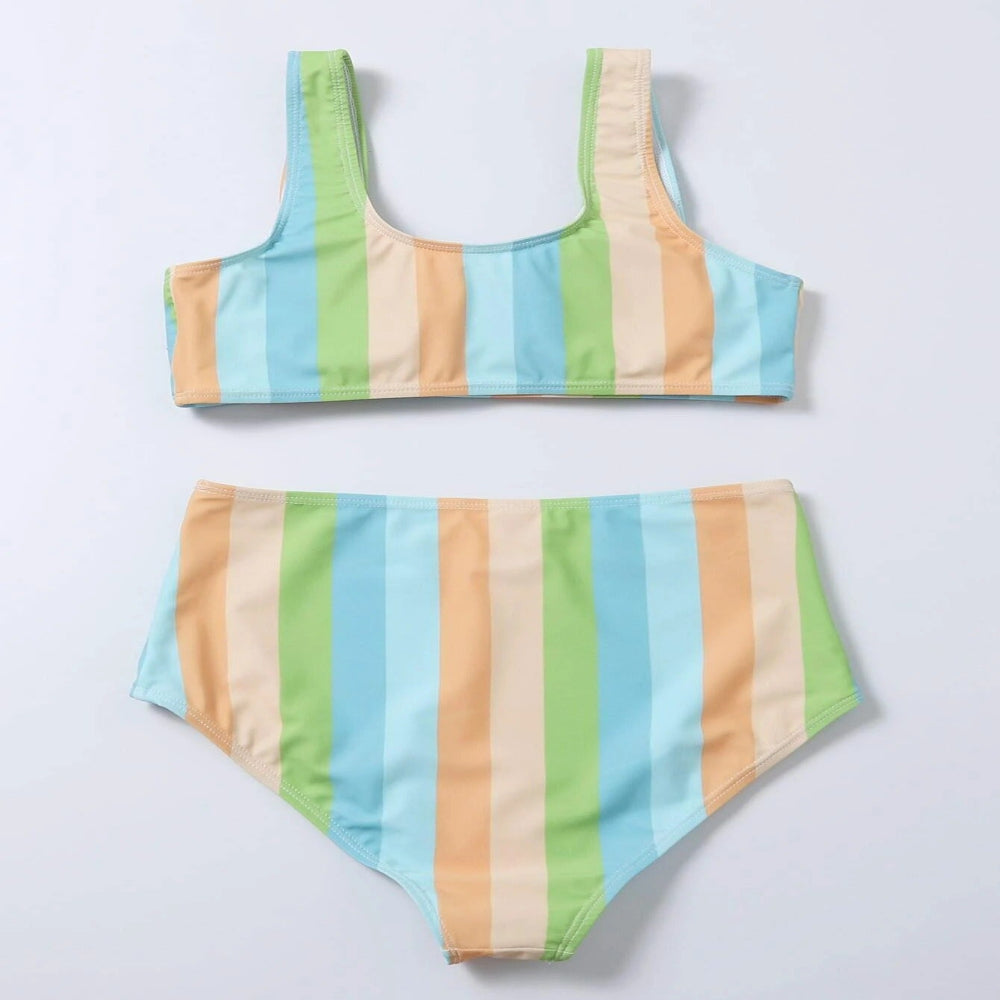 Colorful striped bikini set on a light gray background