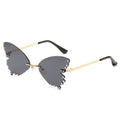 Rimless butterfly sunglasses with dark gray lenses, rhinestone edges, and gold temples, product photo on a white background.
