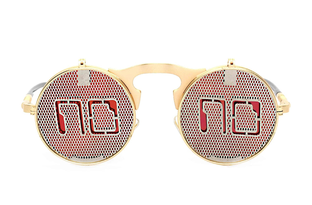 Gold flip-up steampunk sunglasses with mesh covers over red lenses and a cutout “NO” graphic, front product photo on a white background.