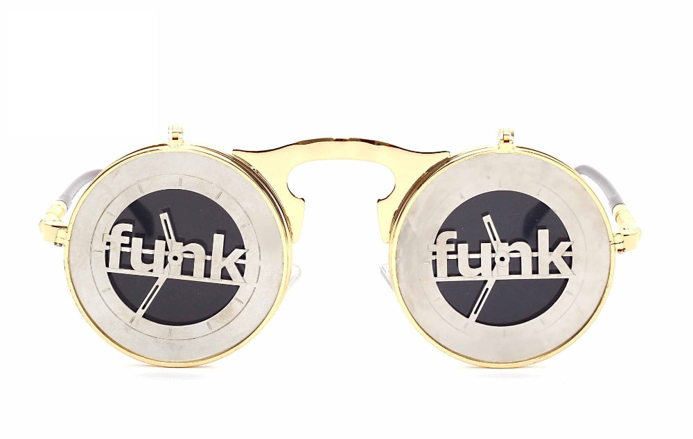 Gold flip-up steampunk sunglasses with silver “funk” letter covers over dark lenses, front product photo on a white background.
