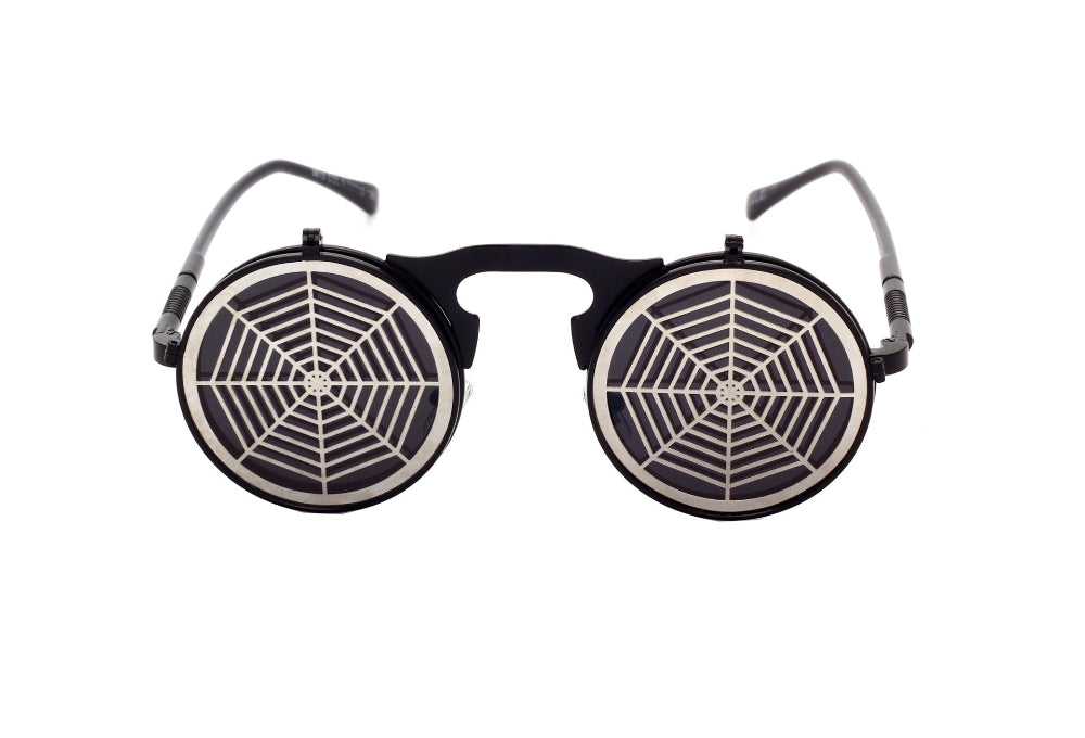 Black flip-up steampunk sunglasses with silver spiderweb covers over dark lenses, front product photo on a white background.