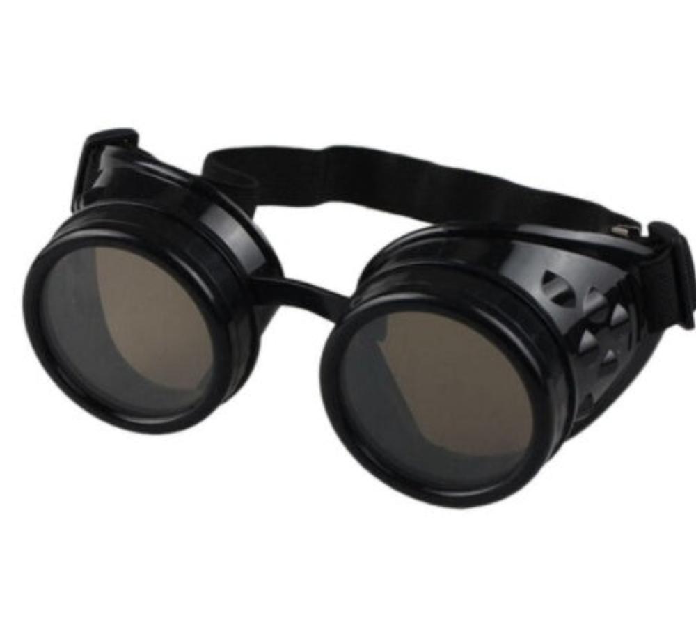 Black steampunk welding goggles with dark round lenses and a black elastic strap, product photo on a white background.