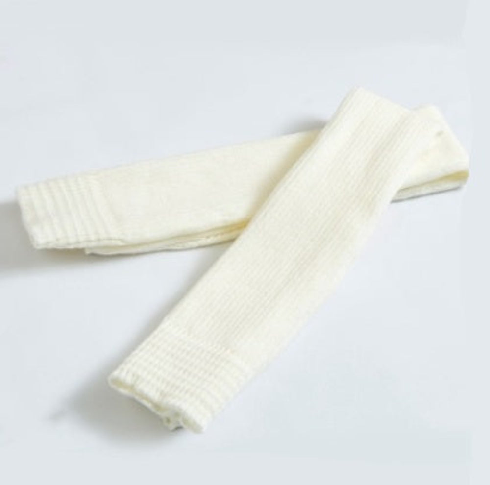 Cream ribbed knit leg warmers, product photo on a white background.
