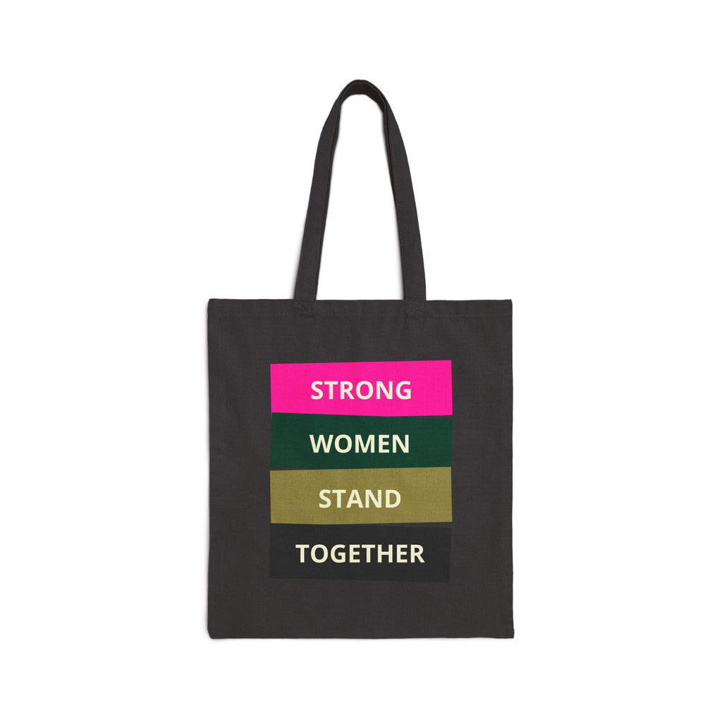 Black tote bag with 'STRONG WOMEN STAND TOGETHER' text on a white background