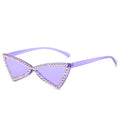 Rimless pink heart-shaped sunglasses with gold temples, product photo on a white background.