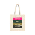 Natural canvas tote bag with "SISTERS LIFT SISTERS HIGHER" graphic in colorful blocks.