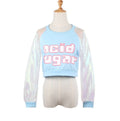 Light blue cropped sweatshirt on a mannequin featuring bold acid sugar graphic text across the chest and sheer iridescent holographic long sleeves with matching blue cuffs. The trendy Y2K-style top has a relaxed fit and round neckline.