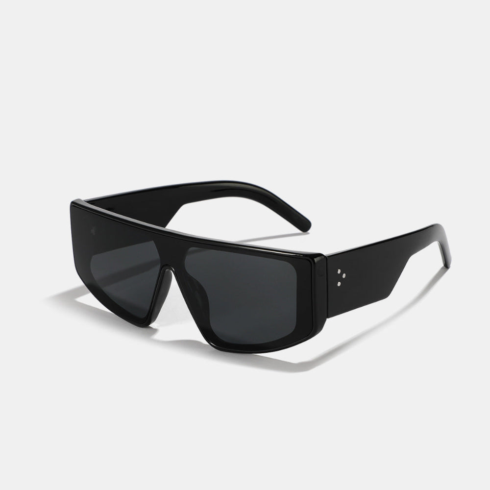 Bold black oversized shield-style sunglasses featuring a thick rectangular frame and dark smoke tinted lenses, modern futuristic design