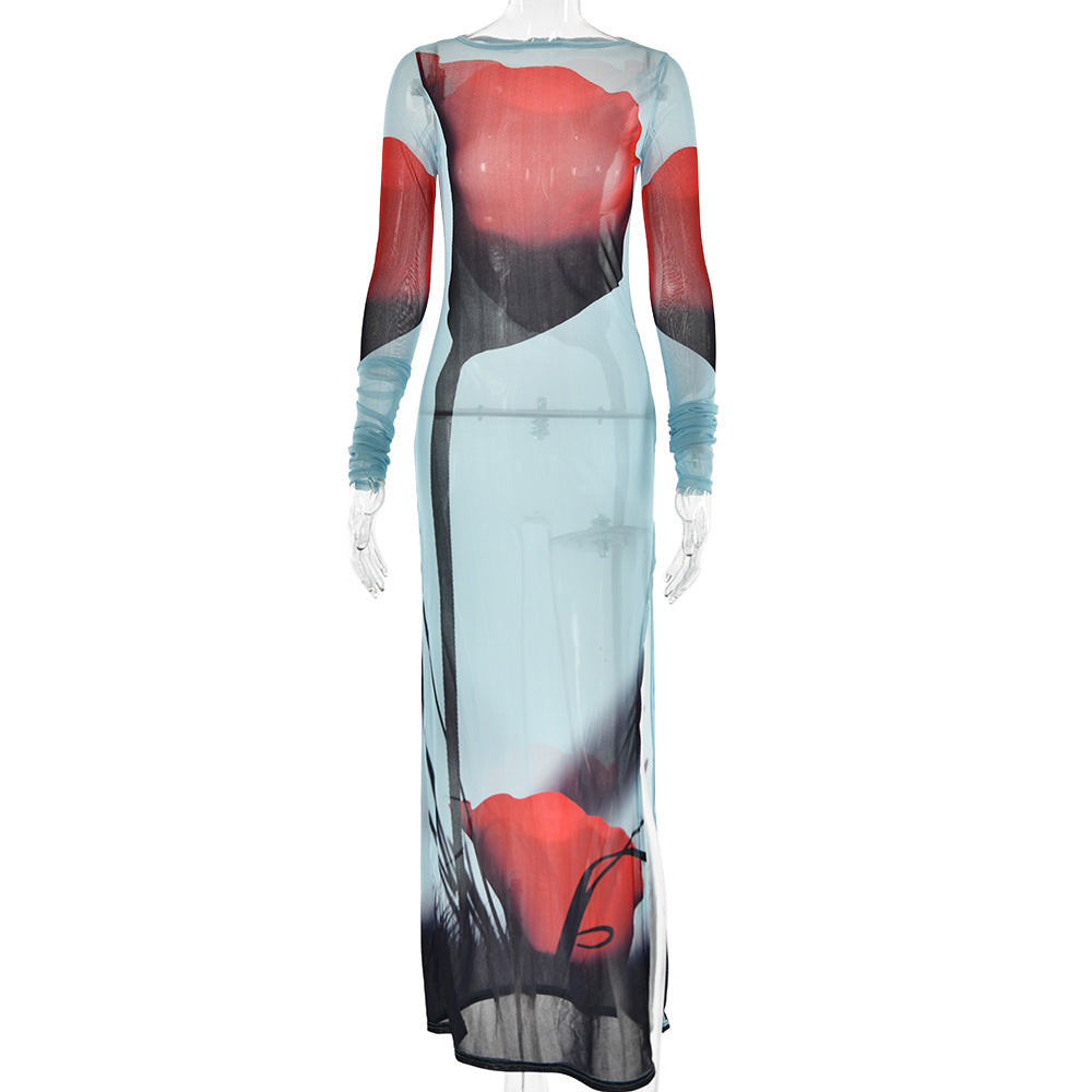 "Long sheer dress with abstract red, black, and blue watercolor design on a mannequin against a white background"