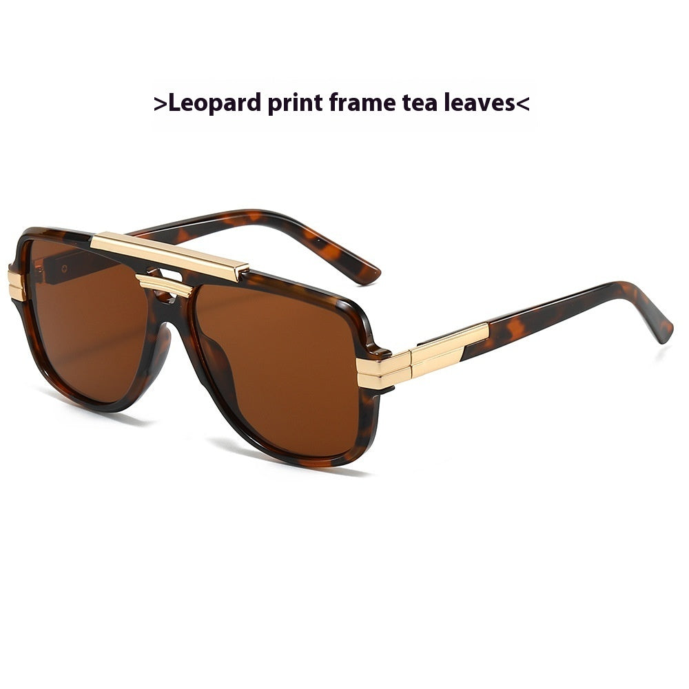 Leopard-print square retro sunglasses with gold brow bar and tea-brown lenses, product photo on a white background.
