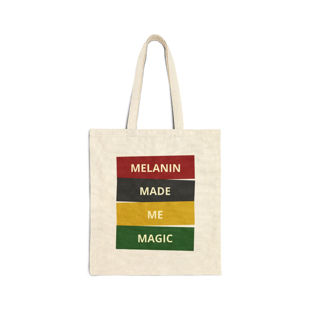Natural canvas tote bag with "MELANIN MADE ME MAGIC" graphic in red, black, yellow, and green blocks.