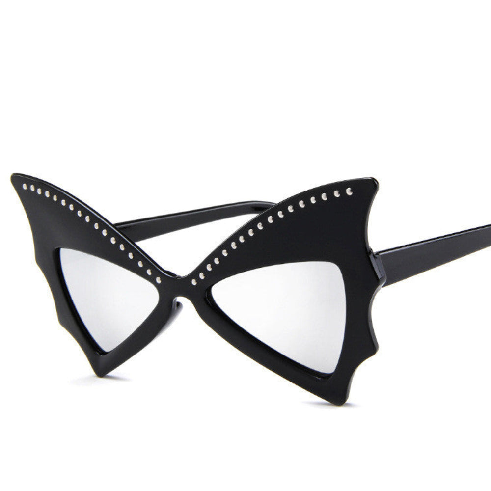 Black batwing sunglasses with rhinestone brow line and light mirror lenses, product photo on a white background.