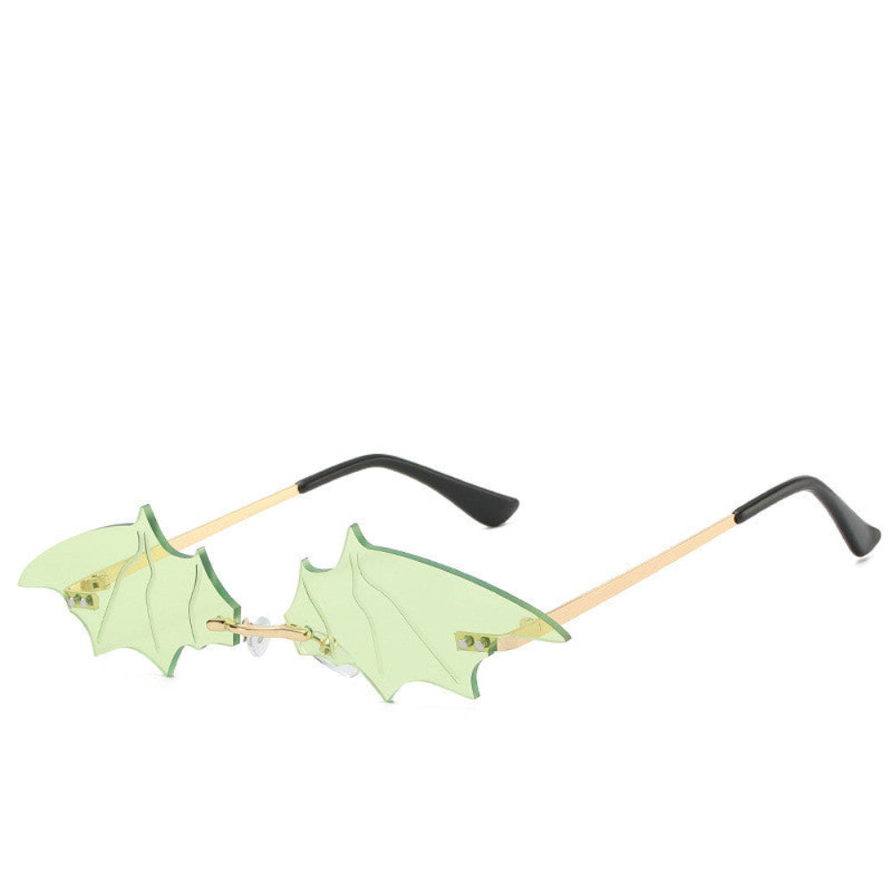 Rimless light-green bat-wing sunglasses with gold temples, product photo on a white background.