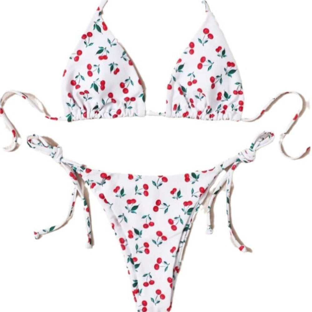 Cherry print bikini set with triangle halter top and tie-side bikini bottom.