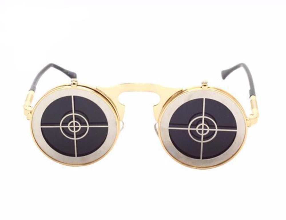 Gold flip-up steampunk sunglasses with round target-crosshair covers over dark lenses, front product photo on a white background.