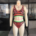 Leopard print bikini set with neon mesh panel and color block detail on mannequin.