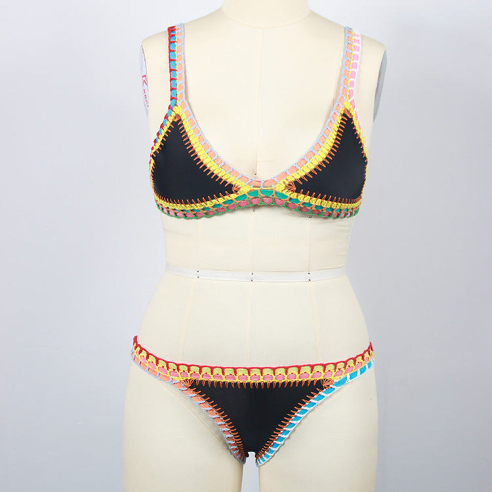 Black bikini set with colorful contrast stitch trim on triangle top and bottom on mannequin.