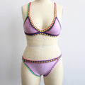 Lavender bikini set with colorful contrast stitch trim on triangle top and bottom on mannequin.