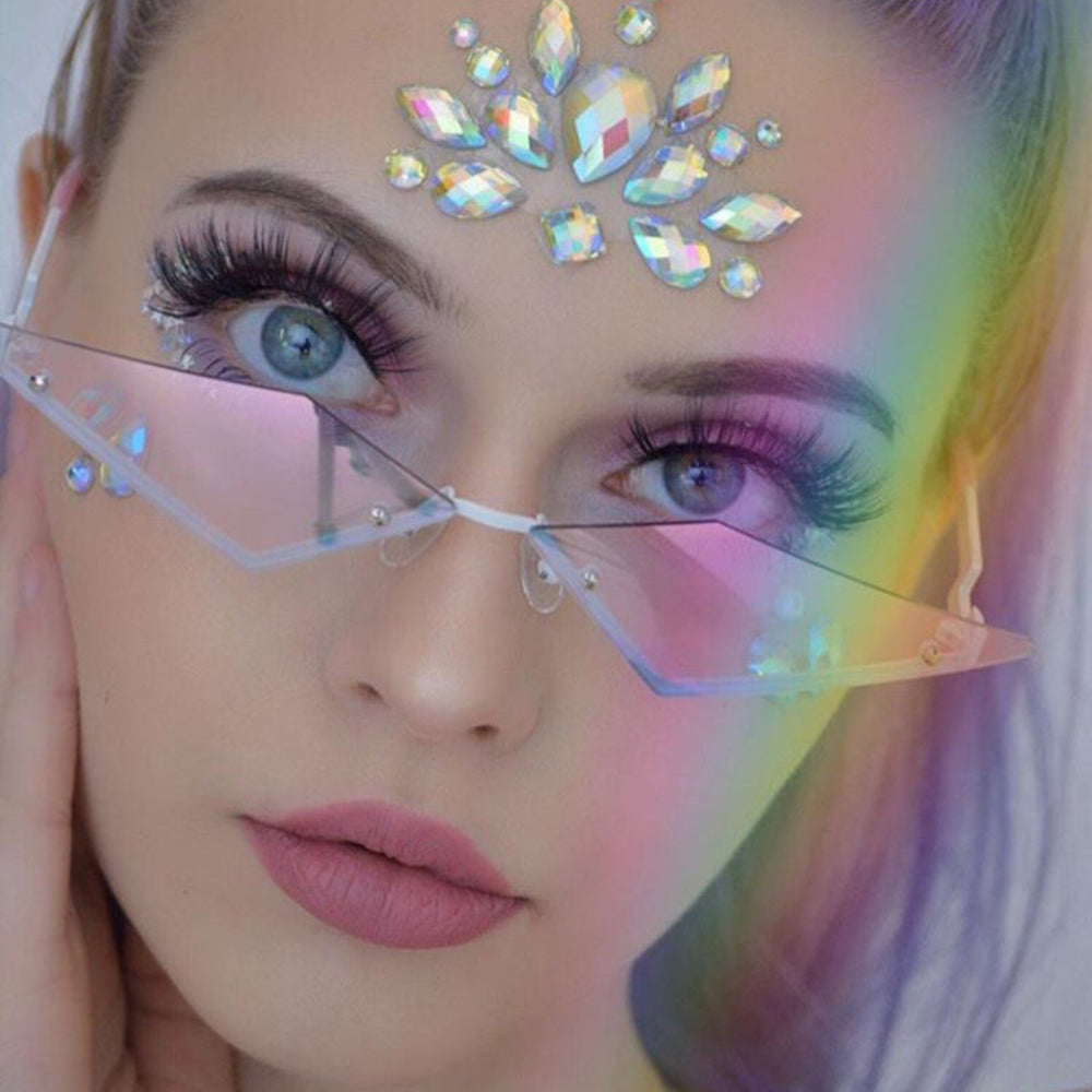 Model wearing rimless triangle sunglasses with iridescent pink lenses.