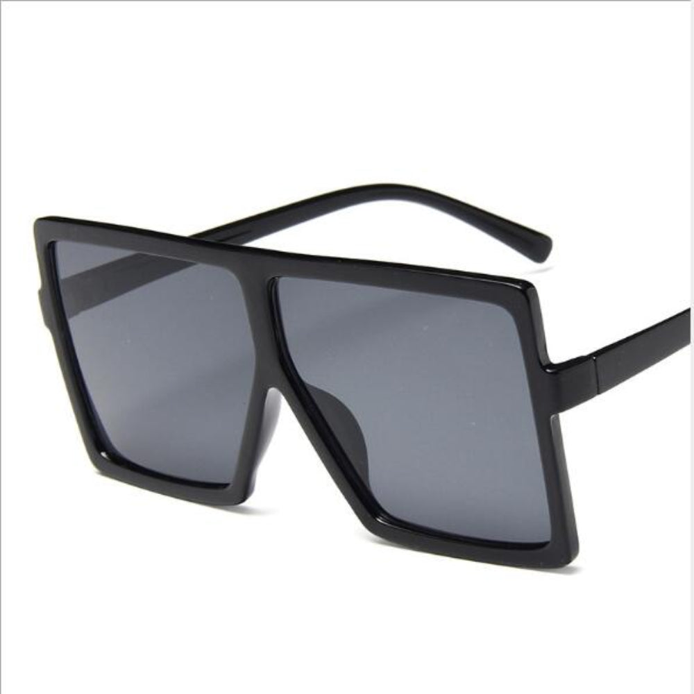 Black sunglasses with dark lenses on a white background