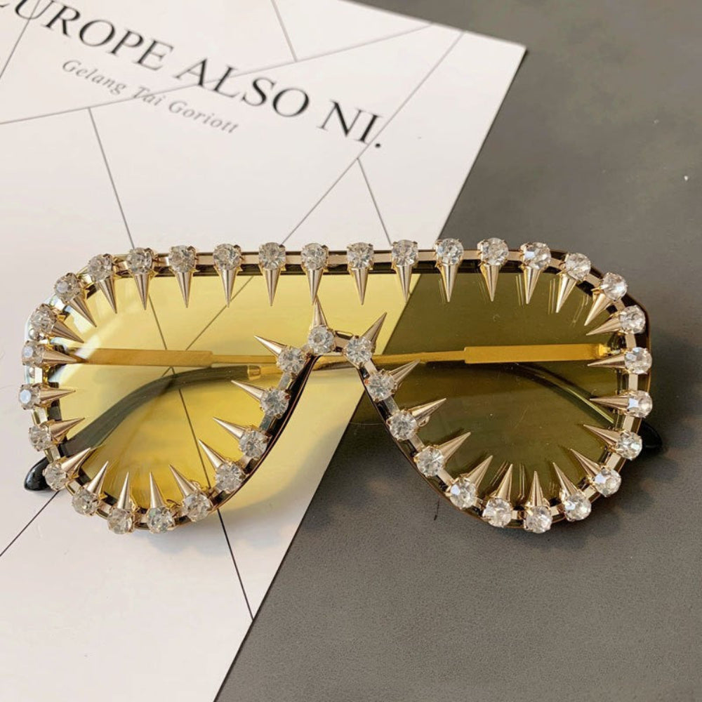 Gold spike crystal sunglasses – trendy statement designer sunnies with spikes and rhinestones, product close-up.