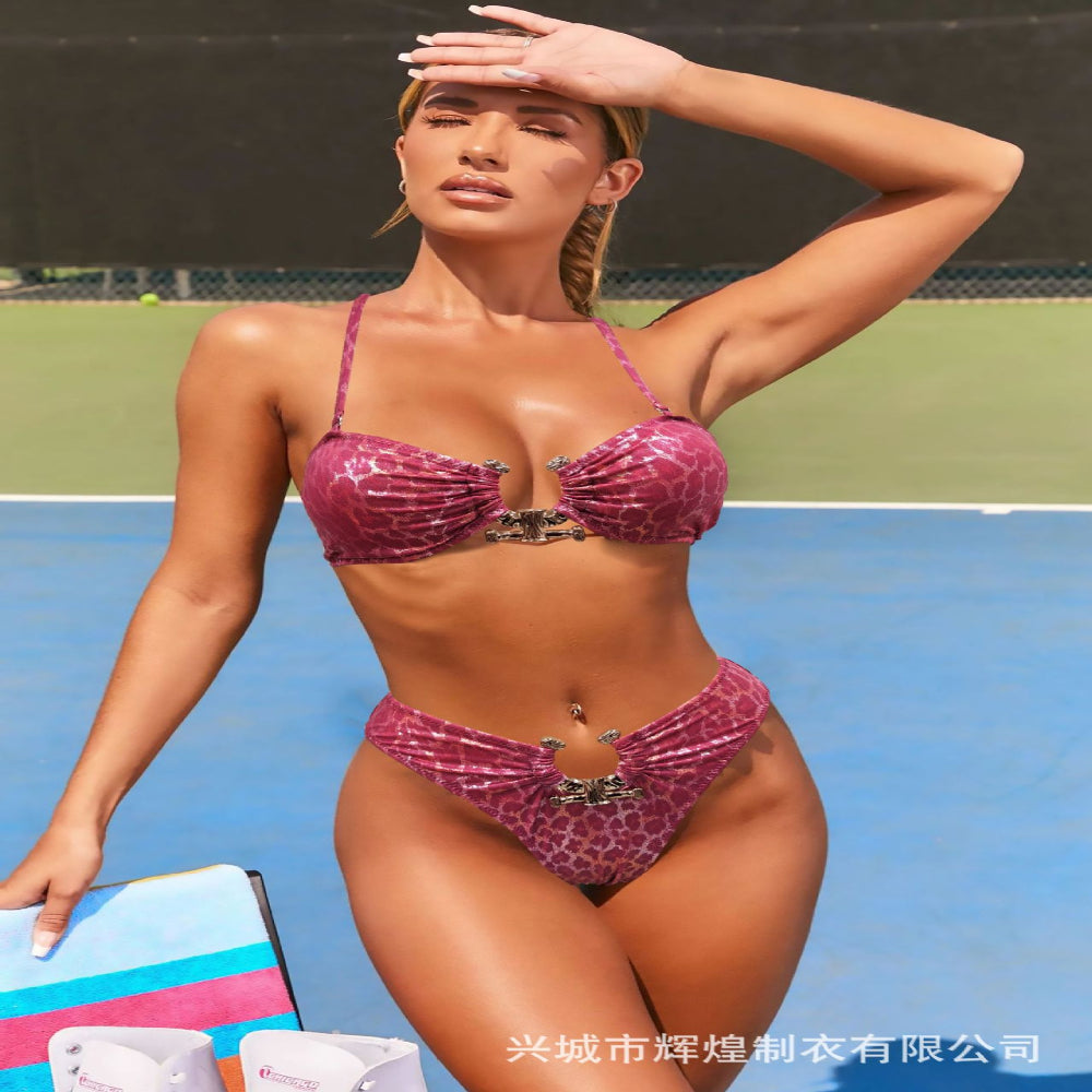 Woman in a pink bikini on a tennis court