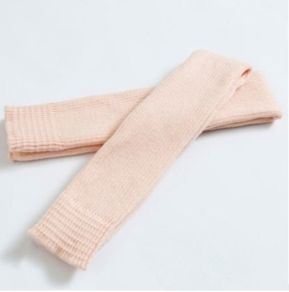 Blush ribbed knit leg warmers, product photo on a white background.