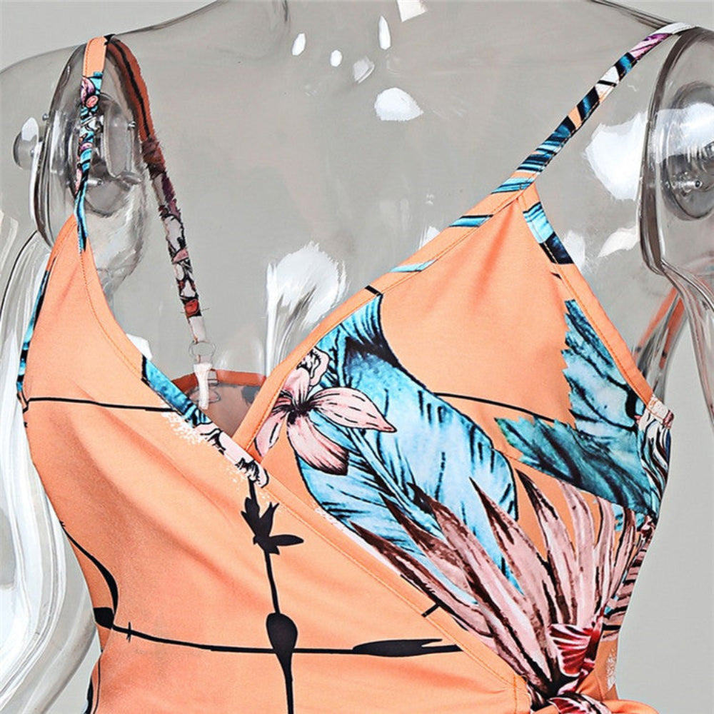 Peach tropical floral bikini top on mannequin – trendy orange palm leaf print swim top, studio product view.